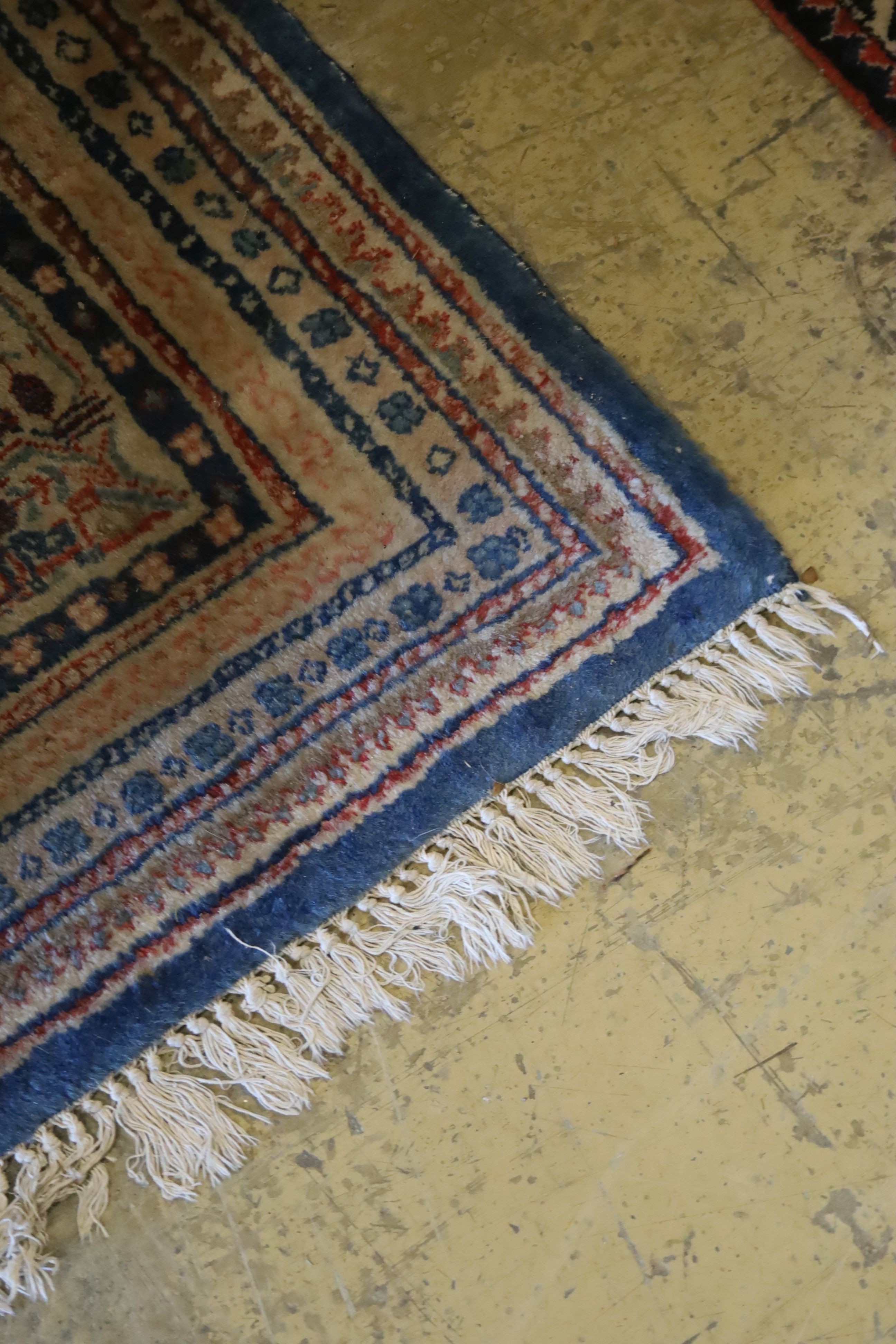 A Tabriz blue ground carpet